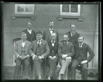 'Faculty, June 1897 Front row, left to right, James Stewart (Math); R.A. Armstrong (Eng); John I. Harvey (Mod. Lang); St. George Tucker Brooke (Law); Sam Brown (Geo); Back, left to right, P.B. Reynolds (Metaphysics); Thomas Hodges (Phys); R.W. Donthat (Ancient Lang).'