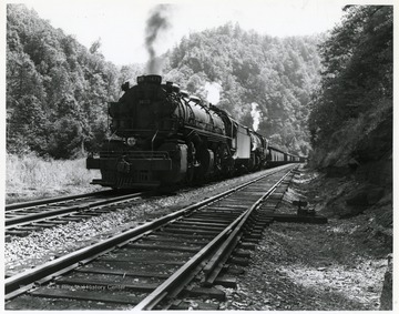 Image from the collection of the Chesapeake and Ohio Historical Society. 'CSPR-3728; C. &amp; O. H-6 Mallet #1479 doubleheading with a second 2-6-6-2 on coal train on Piney Creek branch near Sanaford, W. Va.'