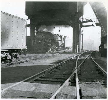 Image from the collection of the Chesapeake and Ohio Historical Society. 'CSPR-283: K-4 Kanawha #2716 under coal dock at Hinton, W. Va. in March, 1946.'