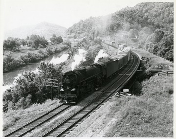 Image from the collection of the Chesapeake and Ohio Historical Society. 'CSPR-3350: K-4 Kanawha #2743 in nice curve, from overhead 3/4 with manifest freight on Big Sandy Subdivision, very scenic; near Prestonsburg, Ky.'