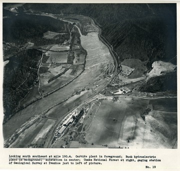 'Looking south southeast at mile 190.4.  Carbide plant in foreground; Buck hydroelectric plant in background; substation in center; Unaka National Forest at right, gaging station of Geological Survey at Ivanhoe just to left of picture.'
