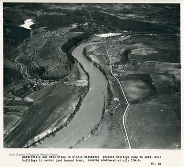 'Austinville and zinc mines in middle distance; present tailings dump to left; mill buildings in center just beyond town; looking southwest at mile 184.6.'