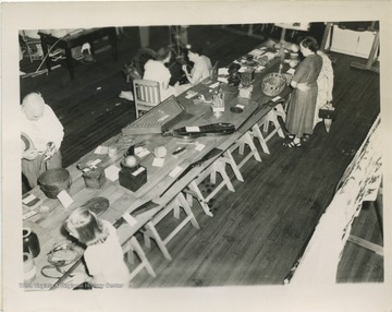 'One of the display tables at the festival showing some of the domestic items common to a mountain home two generations ago.'