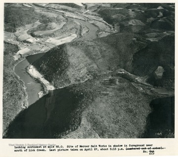 'Looking southeast at mile 83.0.  Site of Mercer Salt Works in shadow in foreground near mouth of Lick Creek.  Last picture taken on April 27, about 5:15 p.m.'