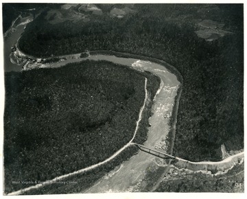 'Looking southeast at mile 5.4.  Bridge at Cotton Hill on U.W. Highway No.19, Highway extends down Laurel Creek from west (left) follows down New River canyon for about two miles, then turns east.'