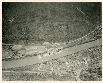 'Marmet Lock under construction by U.S. Engineers, just above Lock 5 which it is designed to replace.  Marmet, West Virginia, in foreground.  Platt cross Kanawha River.  Looking east northeast 28 miles below mouth of Gauley River.  Taken about 1:30 p.m., April 28, 1932.'