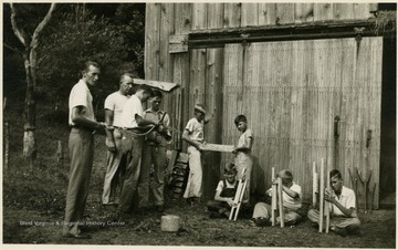 'Many rope machines were made, after which club boys made rope and halter. Mayford Ours and Kelcel Lickefoose, both f-H club leaders, are the instructors.'