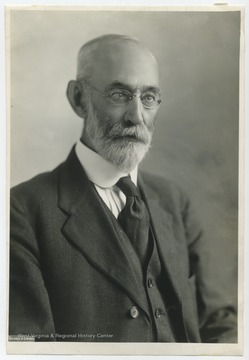 'The name of Thomas Clark Atkeson is inseparable from West Virginia agriculture. He was born on the family farm near Buffalo, Putnam County. He received such schooling as was available during the unsettled war times and then enrolled in West Virginia University in 1871 with the intention of studying agriculture. He found that no such course was offered. He took the usual academic subjects for one year and then returned to work on the farm and to write for The West Virginia Agriculturist, a publication which he established. He sold the paper and went to Kentucky to attend Kentucky Agricultural and Mechanical College. After receiving a bachelor of laws degree, he briefly returned to journalism before establishing a law practice in Buffalo. From 1880 he took an active part in work of the grange and in 1891 wrote the law which created the West Virginia State Board of Agriculture. For the next fourteen years he served as President of the Board. One of his first tasks was to recommend to the University Board of Regents that agriculture be taught at the state university. This recommendation was accepted and Atkeson was appointed the first dean of the College of Agriculture when it was established in 1898. Dr. Atkeson’s work in agricultural education was so widely recognized that he was awarded four honorary degrees from other colleges. He was the author of numerous articles and bulletins. His books include Pioneering In Agriculture; Semi-centennial History of the Patrons of Husbandry, Bookkeeping for Farmers and A Catechism of Agriculture  with D.W. Working as co-author. Return to Mary Atkeson, 3625 Sixteenth St. N.W. Washington, D.C.  Copyright by Harris and Ewing - the above credit line must be printed underneath any reproduction of this photo as required by law. Photo for your use only. Not to be syndicated, rented, or loaned.'