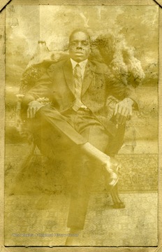 A portrait of Hunter Robinson, seated.  Inscribed inside '123 Brown Street Clarksburg W. Va.'