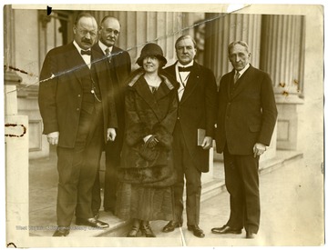 'Senators left the Teapot Dome discussions to wish Mrs. Izetta Jewell Brown, of West Virginia, candidate for Democratic nomination for the Senate, good luck in her campaign.  Left to right they are: Sen. Magnus Johnson, Minn., Sen. Andrieus Jones, New Mex., Mrs. Brown, Sen. Tom Heflin, Ala., and Sen. William King, Utah.'