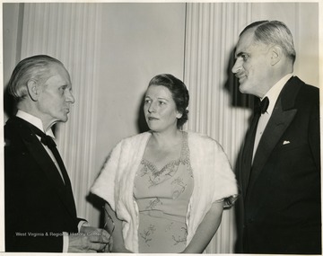 'An anniversary dinner for former winners of the Nobel Peace Prizes was held tonight under the auspices of the Common Council for American Unity.  Because of the war, no new prizes were awarded since the outbreak of Hostilities.  Here, at the dinner, are, (left to right): Sir Norman Angell, Peace Prize Winner in 1933; Pearl Buck, Literature Prize, 1938; and Arthur Holly Compton, Physics Prize, 1936.'
