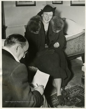 'Pearl Buck American novelist who was awarded the Nobel prize for literature this year, is pictured as she arrived home on the S.S. Aquitania today.  She is telling ship news reporters how much she enjoyed her stay in Stockholm, Sweden, where King Gustave presented her with her prize.'