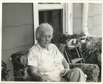 Alice Hammons Wilfong on a porch.