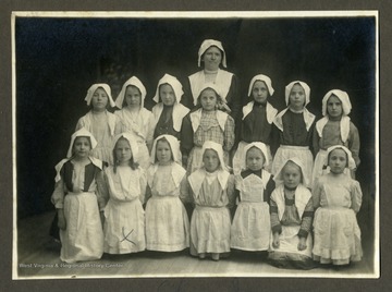 Written on back, 'W. S. Sherwood Jan. 12, 1912; Nelle Fowler (?) and her class at Harrisville.  Alma Hess gave it me.  She mark on Alma's picture on other side.'