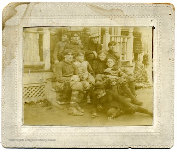'Taken at Morgantown - hatless young man on right, sitting alone, is Herbert W. Dent, son of M. H. Dent.'