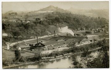 A view of Morgantown: Mississippi Glass factory along the Monongahela River; the Dorsey Knob in the distance.