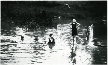 Four members of the Ellison-Dunlap family swimming in Hans Creek.