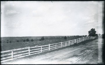 'End of Sheridan's famous ride to battlefield of Cedar Creek looking North. The ridge on the left where the whole fenced cemetery stand was held for a while by our troops and then they were forced back parallel with the pike beyond Middletown, a few houses of which are seen on the right. At the first of them, on the right of the pike. Walter drew water from a well out in the field for the team. (62)D.101; July 30, 1884, Wednesday 12:45 pm'