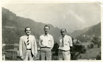Photo from WVU College of Mineral Resources Scrapbook.  Three unidentified men standing outside.