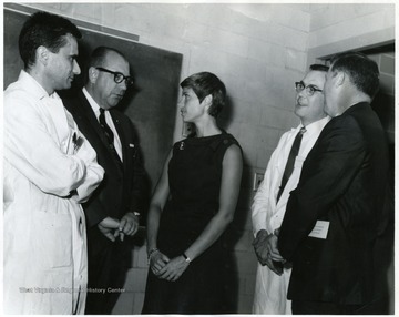 Dr. I.A. Wiles, Superintendent of County Health (second from left,) standing with a group of individuals at the Medical Center.