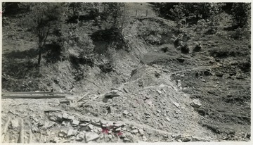 A photograph of a hillside of what appears to be a construction site for a railroad.
