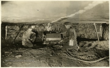 A photograph of coal miners working in a mine. 'Island Creek Coal Sales Co., Cincinnati, Ohio; The following cars of Pocahontas coal were shipped today for account of; 4-Point Pocahontas Coal'