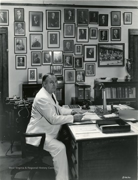 A photograph of Koepler at his desk. 'Notice; Permission is granted to reproduce this photograph only on condition that each reproduction shall bear the following credit line; Photograph by Norfolk &amp; Western Railway'