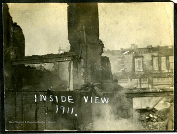 A view of an interior of burned down buildings.