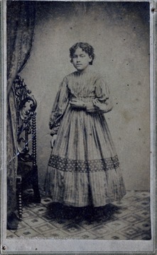 'Pictures of "Aunt Beck" and her daughters Susan and "Little Hat." Until 1861 these were slaves of my Great Uncle Hiram Haymond, Esq.; Signed: Margaret Morrow; Aug. 24th/59'Contains a revenue stamp on the back of the image.Union Gallery, H.B. Hull, Photographer, Fairmont, W. Va.Research has shown that Rebecca 'Aunt Beck' and her daughters, Susan and Harriet, who was also known as Hattie and "Little Hat," had the last name of Wilson.  When Harriet married, her name became Harriet Wilson Whitley.  As a child she was called Hattie and as an adult she became known as "Aunt Hat."