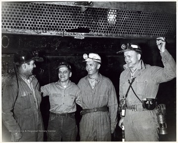 A photograph of Senator Hoblitzell, Jr. standing with a group of miners.