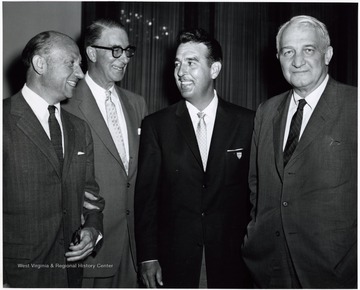'A photograph of Senator Revercomb (right) standing with others, including Estes Kefauver (second from left) and "Tennessee" Ernie Ford (second from right).'