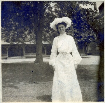 A photograph of Ms. Therland standing outdoors.