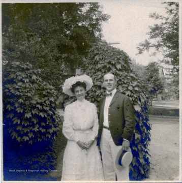 A photograph of Ms. Therland standing outdoors with an unidentified man.