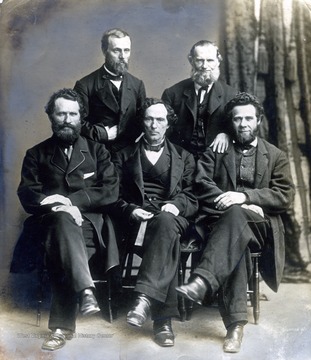 'Nathan Goff, Sr. (center), H. G. Davis (seated right), Jacob C. Beeson (standing right), Joseph Bell (seated left), Richard P. Camden (standing left)'