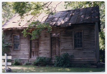 The building was located in a back area of of J. C. Johnson's house and it was occupied by slaves.  It was demolished in 1988. 