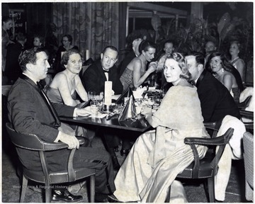 A group seated at a table at what appears to be a formal banquet. 