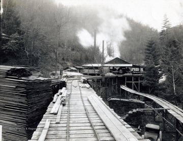 A photograph of a working lumber mill set in an unidentified wooded area in West Virginia.