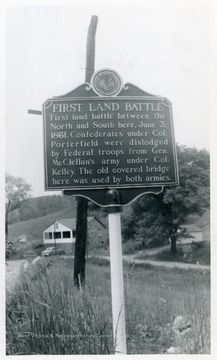 "First Land Battle--First land battle between the North and South here, June 3, 1861.  Confederates under Col. Porterfield were dislodged by Federal troops from Gen. McClellan's army under Col. Kelley.  The old covered bridge here was used by both armies."