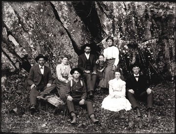 A portrait of people taken at the bottom of rock ledge, Helvetia, W. Va.