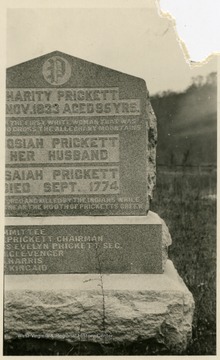 Large stone includes information about various members of the Prickett family of Fairmont. There are two engraved captions...'The First White Woman That Was..Cross The Allegheny Mountains' and ...'And Killed By The Indians...While Near The Mouth Of Pricketts Creek.'