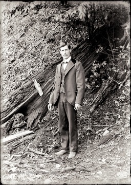 A portrait of young man by the hillside.