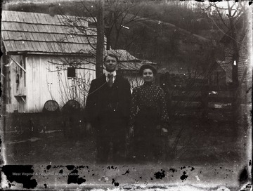A portrait of couple taken outside of the house in Helvetia, W. Va.