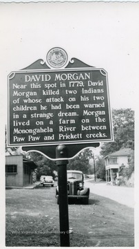 'Near this spot in 1779, David Morgan killed two Indians of whose attack on his two children he had been warned in a strange dream. Morgan lived on a farm on the Monongahela River between Paw Paw and Prickett creeks.'