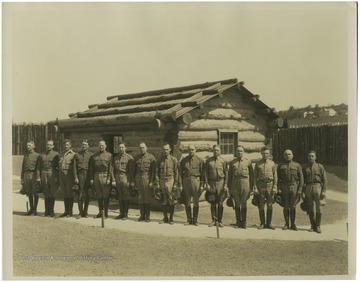 Men in uniforms standing in front of fort.