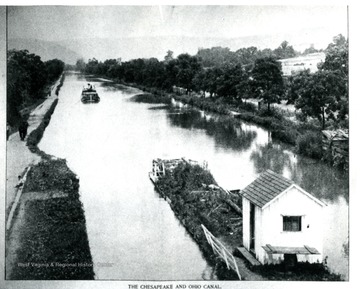 "This famous old Canal was built in the 1820's before the Conception of railroads.  By a series of locks, one of which is shown in the pix, this canal was the original means of travel between Washington and Cumberland, following the bed of the Potomac River.  It was completed with business on this waterway that the B. &amp; O. R. R. was conceived and built in 1828."  [The boat is being towed along by mules on the left side of the pix].