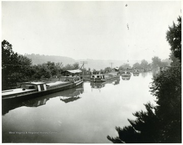'Scenic picture of the Chesapeake &amp; Potomac Canal running from Cumberland, Maryland to Washington, D.C., a distance of 184 miles. It was constructed in 1840 in competition with the Consolidation Coal Company Rail Transportation. Later is was purchased by Consol and operation was canceled in 1924.'