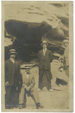 Great Uncle Lawrence Pietro, Thoney Pietro, Lawrence Pietro, and Henry Pietro standing in front of rock caves in Williamson, W.Va. Back of postcard reads' Morgantown family who came to Morgantown in 1904. All Italian intermarriages except one Belgian woman.'