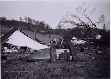 People at the site a church used to stand, aftermath of tornado of 1948, Mount Clare, W. Va.