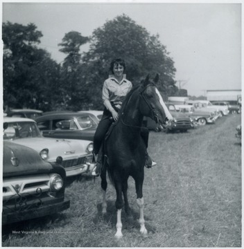 'Miss Christina Bunda of Uniontown, P.A. will be showing this fine registered Arabian Stallion at the Fourth Annual Albright Horse Show Aug. 12, 1962'