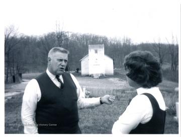 Jesse Stuart and Maryan Dahmer talk in a church yard.